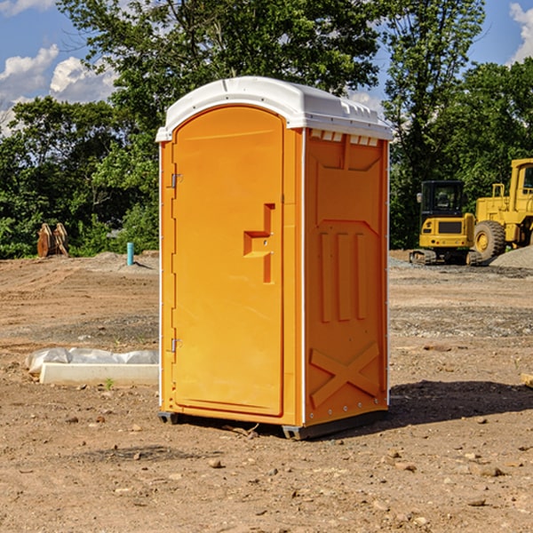 what is the cost difference between standard and deluxe portable restroom rentals in Greenfield